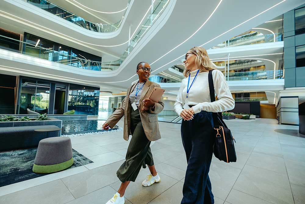 Reduce-sedentary-working_06 26 - optima health Employees walking during a meeting to reduce sedentary work